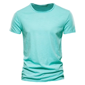 Detail of mint green slub cotton fabric texture and crew neck on a men's t-shirt