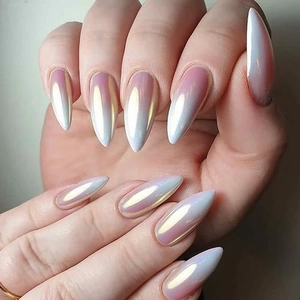 Macro shot of stiletto nails with pink gradient and pearlescent aurora chrome finish