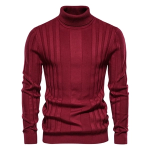 Detailed view of burgundy turtleneck sweater featuring vertical ribbed knit texture