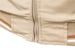 Detail of light khaki jacket showing ribbed hem with white and brown stripes