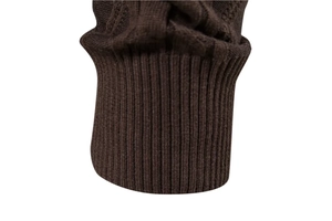 Macro detail of brown V-neck cardigan showing rib-knit cuffs and cable weave texture