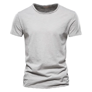 Close-up of light gray slub cotton t-shirt fabric showing textured neck and cuff details
