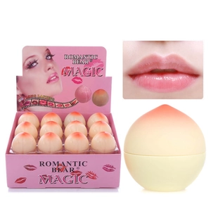 Λεπτομέρεια ενυδατικού lip balm σε σχήμα ροδάκινου με ροζ ντεγκραντέ σχέδιο και εφέ χειλιών