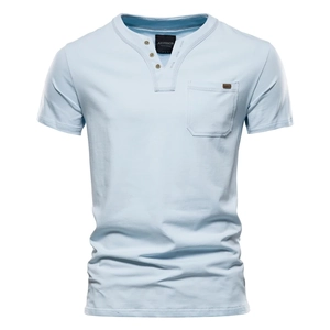 Close-up of light blue Henley neck cotton T-shirt featuring single chest pocket detail