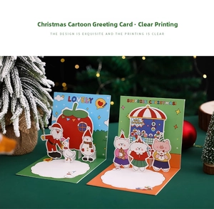 Macro detail of 3D pop-up Christmas cards with gold foil animal and Santa festive designs