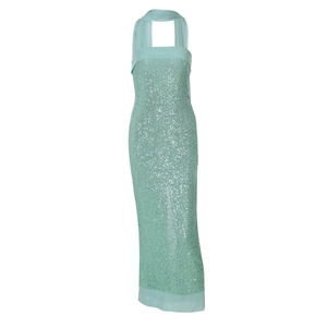 Flat lay of a light green sequined halter neck maxi dress with a matching scarf detail