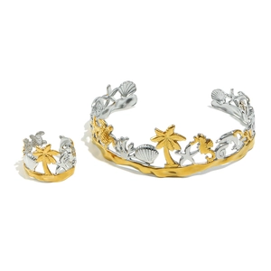 Gold and silver ocean theme jewelry set with starfish, seashell and palm tree motifs