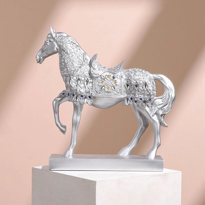 Silver horse sculpture with gems on white display stand for office desk decor