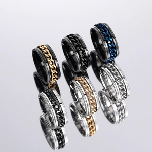 Detail of mechanical rotating chain rings in black, gold, silver and blue finishes