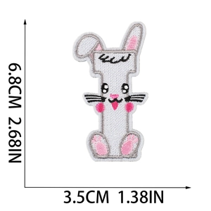 Detailed embroidery texture of white letter I patch with rabbit motif and size dimensions