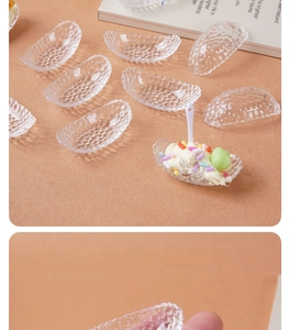Close-up of clear resin boat-shaped miniature tray with granular texture for DIY crafts