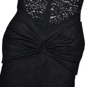 Close-up of black mesh jumpsuit featuring lace bodice and draped knot detail at the waist