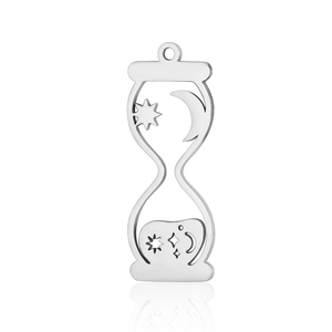 Detailed view of silver stainless steel hourglass pendant with hollow moon and star patterns