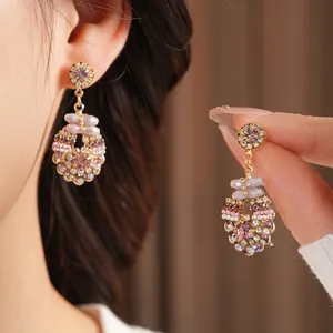 Elegant vintage gold-tone earrings featuring colorful crystals and glass stones