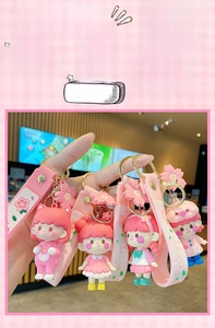 Detail of Sakura girl keychains with soft PVC wristbands and floral pendants