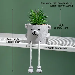 Detail of creative gray cement bear succulent planter with white rope dangling feet decoration