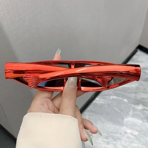 Detail of red metallic sports sunglasses featuring unique fish-scale textured frames