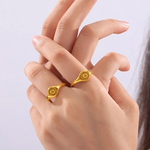 Goddess relief ring with sun pattern in 18k gold plated titanium steel worn on hand