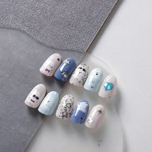 Macro view of 3D cartoon puppy nail art stickers with hand-drawn bow and heart designs