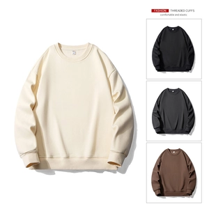Detail of threaded cuffs and elastic hem on a minimalist crewneck sweatshirt for men
