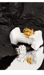 Macro view of textured lava style wide ring showing golden and silver molten metal finish