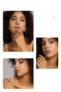 Close-up of butterfly open ring in gold finish on model with matching jewelry set