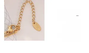Detail of lobster clasp and adjustable extension chain with K18 gold engraving