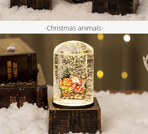 Close-up of vintage Christmas water lantern with Santa and reindeer miniature inside
