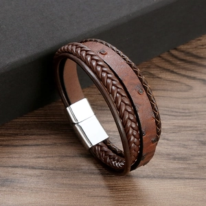 Detail of brown multilayer braided leather bracelet with stainless steel magnetic clasp