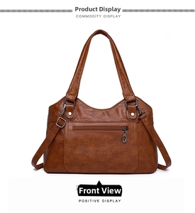 Détail frontal du grand cabas en cuir lavé marron vintage avec poche zippée pratique