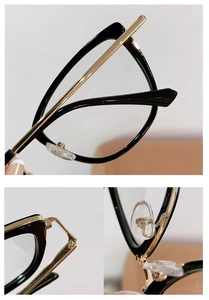 Close-up of cat-eye frames featuring black acetate and gold metal hinge details