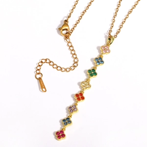 Golden stainless steel necklace featuring colorful zircon clover charms on a white background