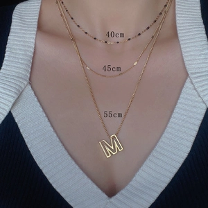 Set of three layered 18k gold plated stainless steel chain necklaces in 40, 45, and 55 cm