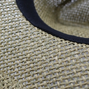 Straw sun hat with tight weave texture and black sweatband for outdoor protection