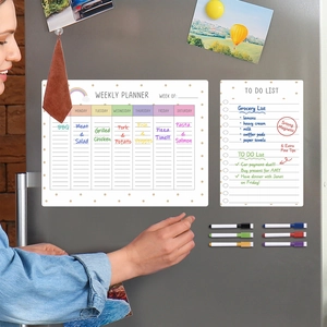 Close-up of magnetic weekly planner and to-do list on fridge with 6 fine tip markers