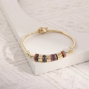 18K gold plated copper bangle with colorful cubic zirconia in a geometric design