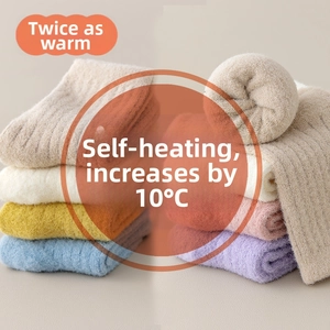 Close-up of thick thermal knit socks in various soft candy colors for winter warmth