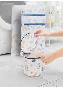 Macro detail of cartoon printed mesh laundry bag with cylinder support for delicates