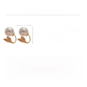 Detail view of gold leaf earring with zircon accents and a large white pearl pendant