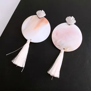 Elegant silver shell stud earrings with pink marble discs and soft white tassel drops