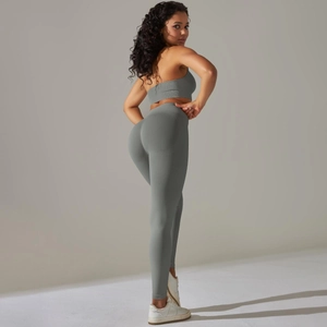 Detail of ribbed seamless grey yoga set featuring high-waisted leggings and crop top