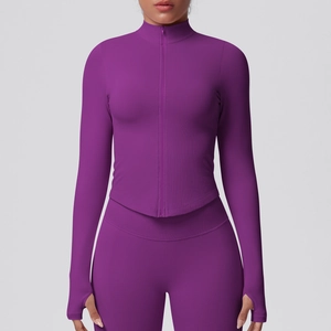 Close-up of deep purple slim-fit yoga jacket with thumbholes and stand-up collar