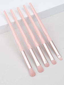 Detail of 5-piece pink diamond-shaped eye makeup brush set with rose gold ferrules