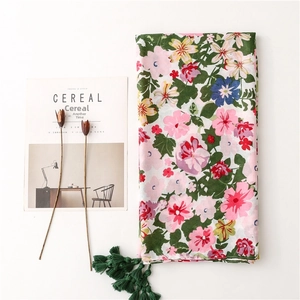 Floral cotton linen beach shawl with colorful flower prints and green fringe tassels