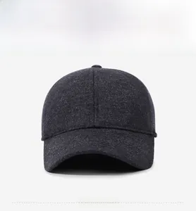 Close-up of dark grey wool blend cap featuring a mountain logo and high-density warm fabric