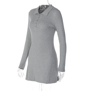 Detail showing grey ribbed knit texture and polo collar with button-down placket on the dress