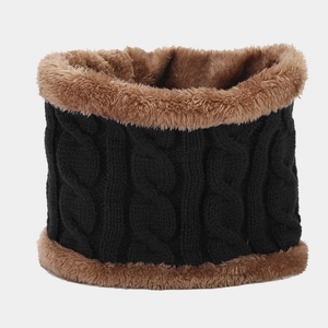 Macro detail of thick cable knit winter neck warmer with warm faux fleece lining