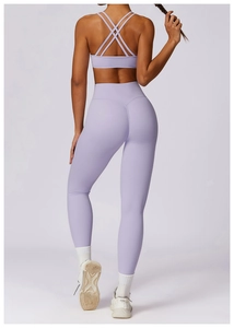 Detail of lavender yoga set with cross-back sports bra and high-waist slim fit leggings