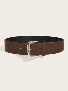 Close-up of brown suede wide belt featuring a polished silver buckle and smooth black lining
