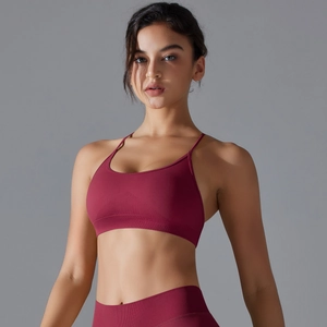 Detail of burgundy seamless yoga bra with ribbed underband and thin shoulder straps